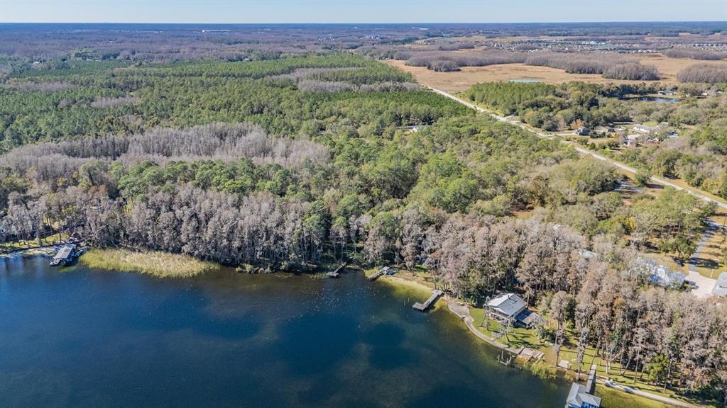 5504 Sun Up Road Land O' Lakes, FL 34638 - Photo 15 of 19 a view of lake with mountain