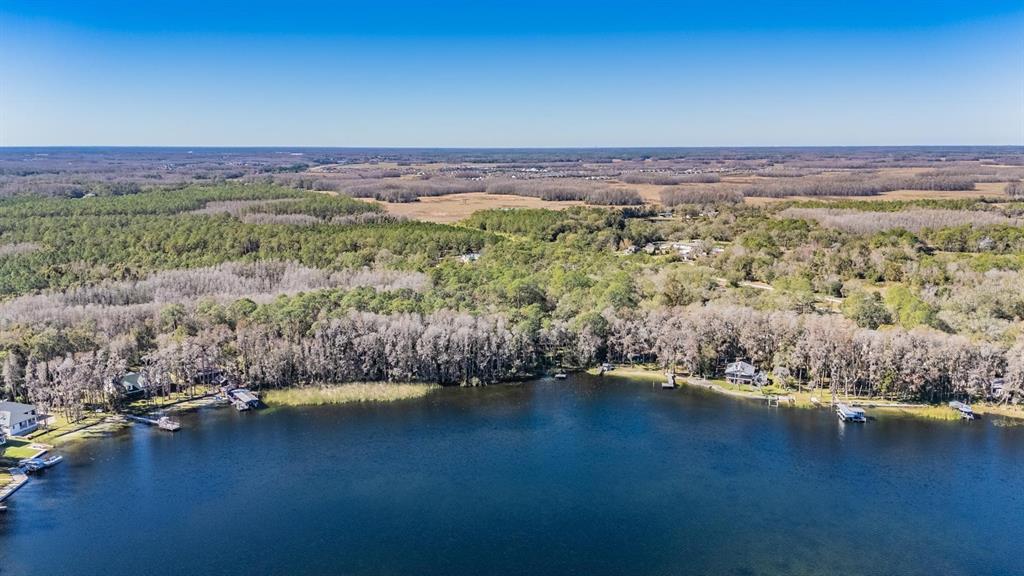 5504 Sun Up Road Land O' Lakes, FL 34638 - Photo 19 of 19 a view of a lake with a mountain
