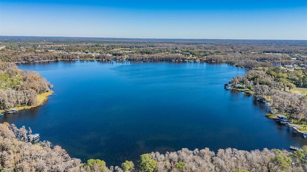 5504 Sun Up Road Land O' Lakes, FL 34638 - Photo 3 of 19 a view of a lake with a mountain