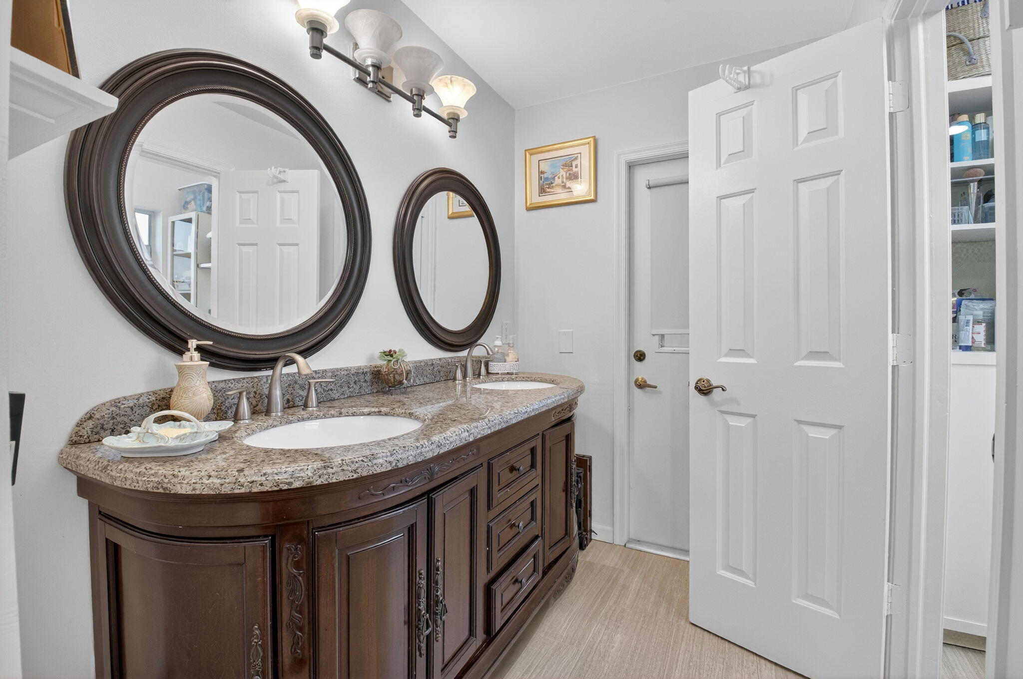 23265 Southwest 61st Avenue Boca Raton, FL 33428 - Photo 19 of 44 a bathroom with a granite countertop double vanity sink and a mirror