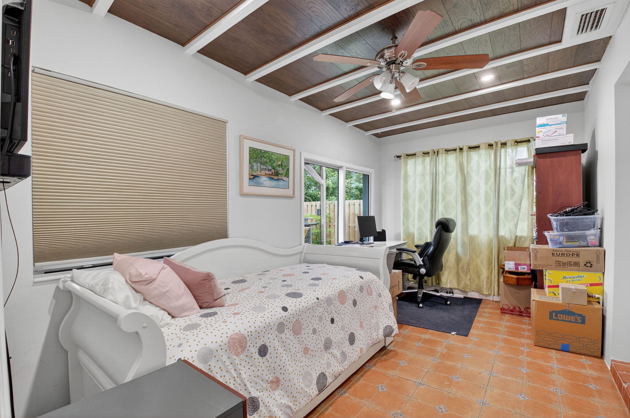 23265 Southwest 61st Avenue Boca Raton, FL 33428 - Photo 28 of 44 a bed room with a bed and a chandelier