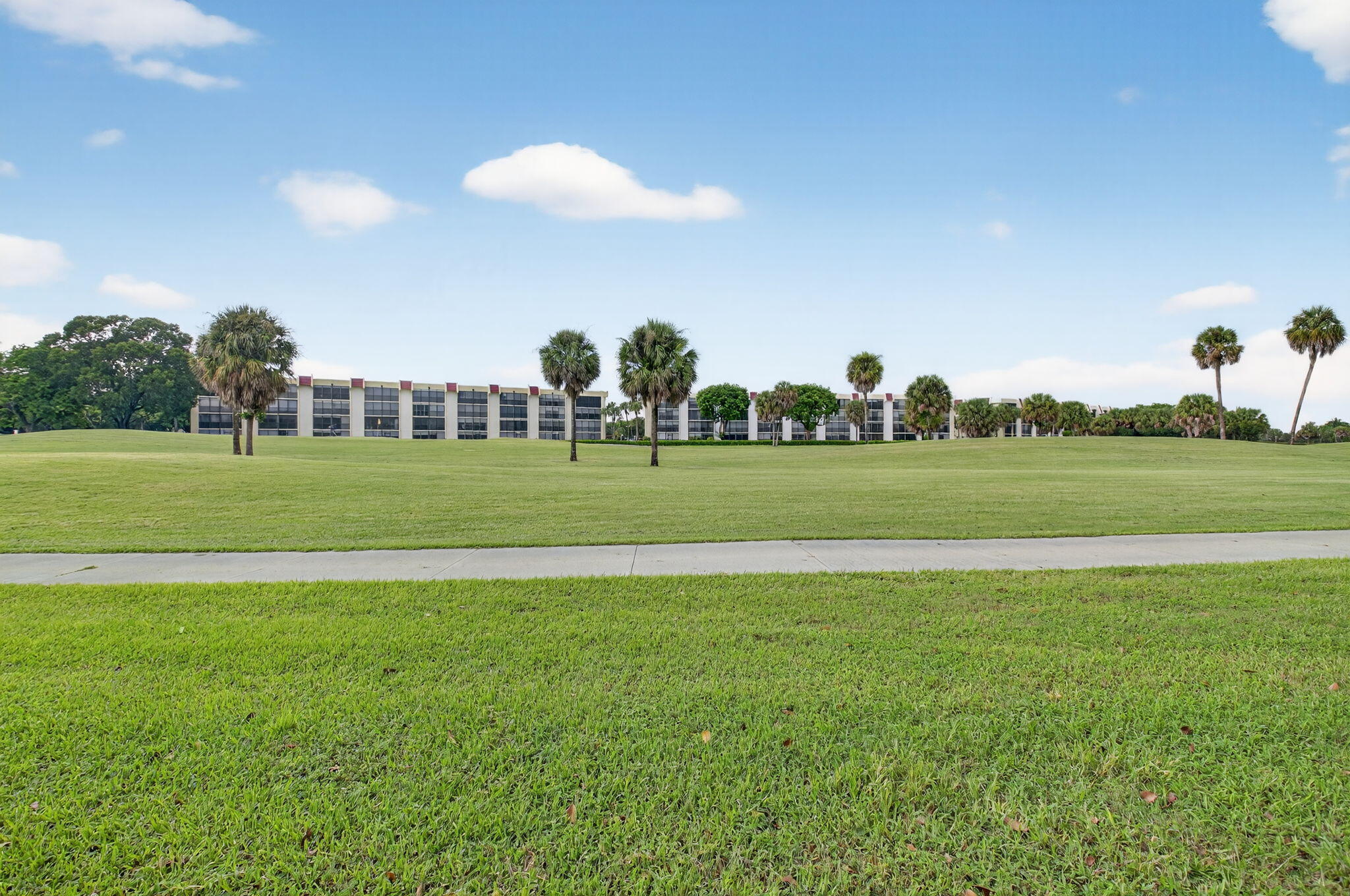 23265 Southwest 61st Avenue Boca Raton, FL 33428 - Photo 34 of 44 a view of a golf course with a field