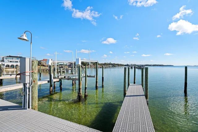 a swimming pool with outdoor seating and yard