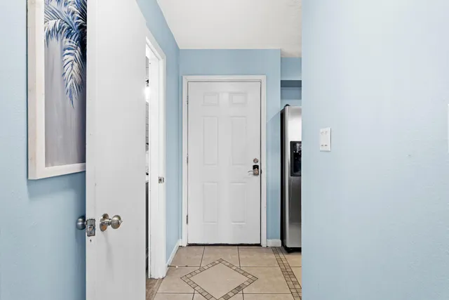 a kitchen with lots of counter space sink and a chandelier