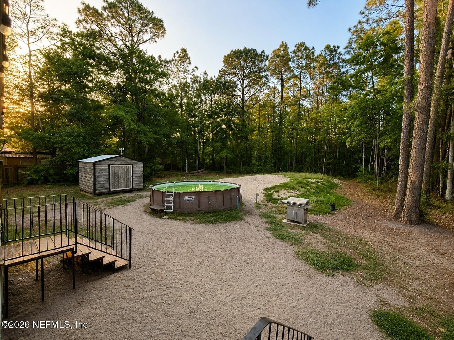 124 Jack Road Palatka, FL 32177 - Photo 17 of 18 a view of a small yard and a patio