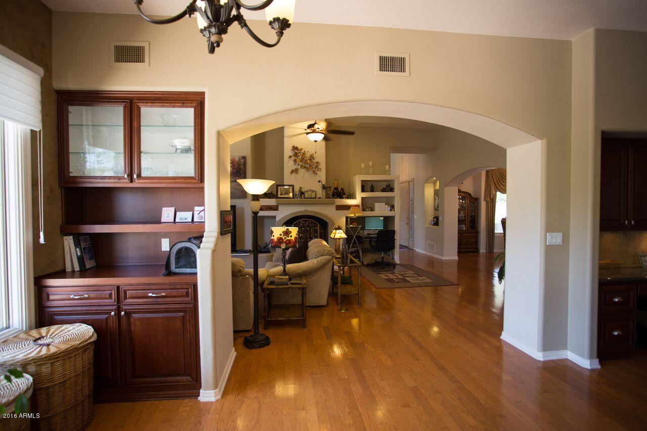 2301 East Mountain View Road Phoenix, AZ 85028 - Photo 2 of 58 Family Room and fireplace view from ki