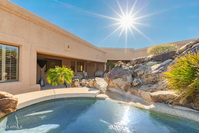 a view of an entryway with table and chairs