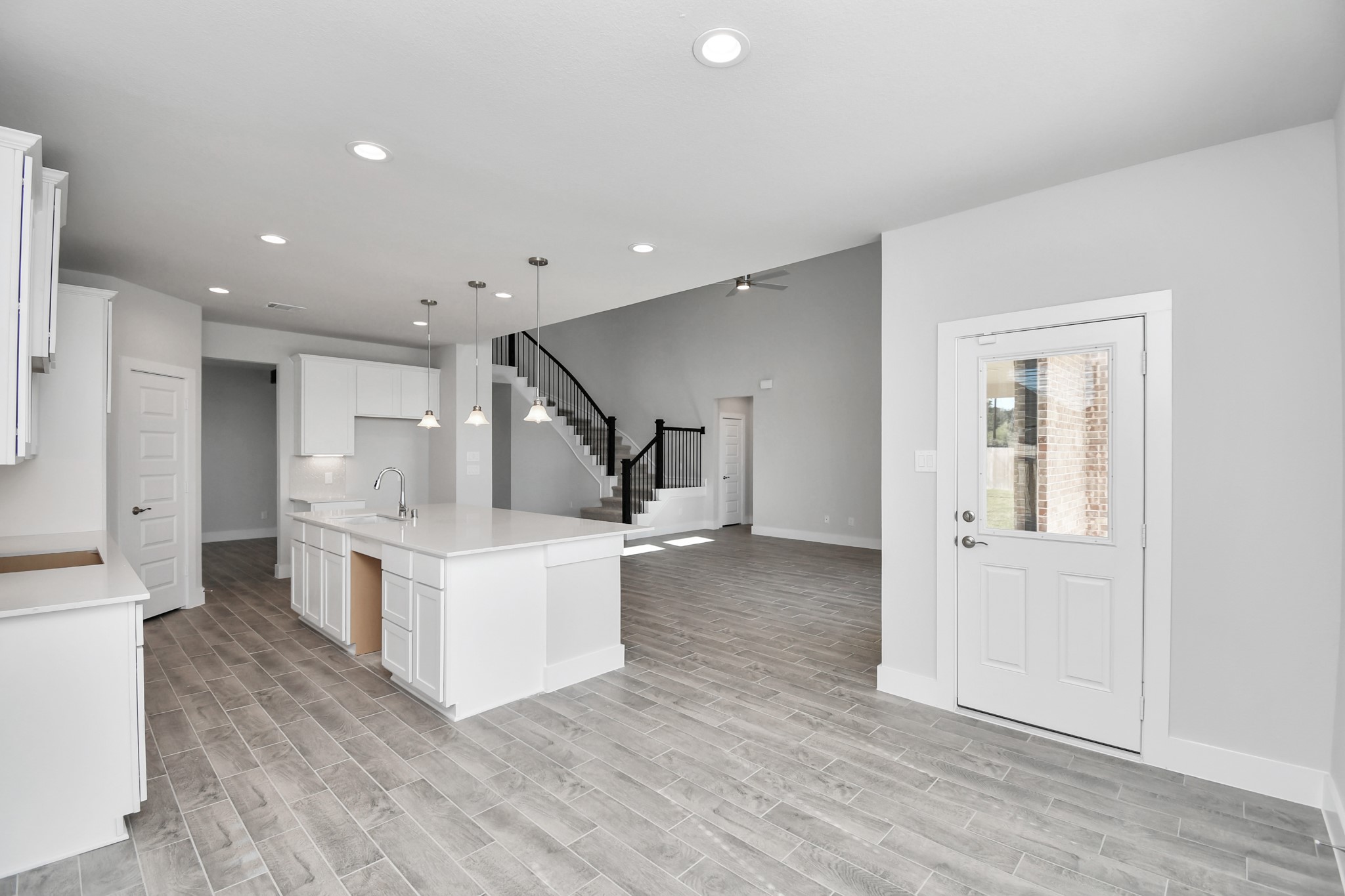 3103 Native Spg Drive Spring, TX 77373 - Photo 14 of 36 View from the breakfast area to the kitchen and living room. Sample photo of completed home with similar floor plan. Actual colors and selections may vary.