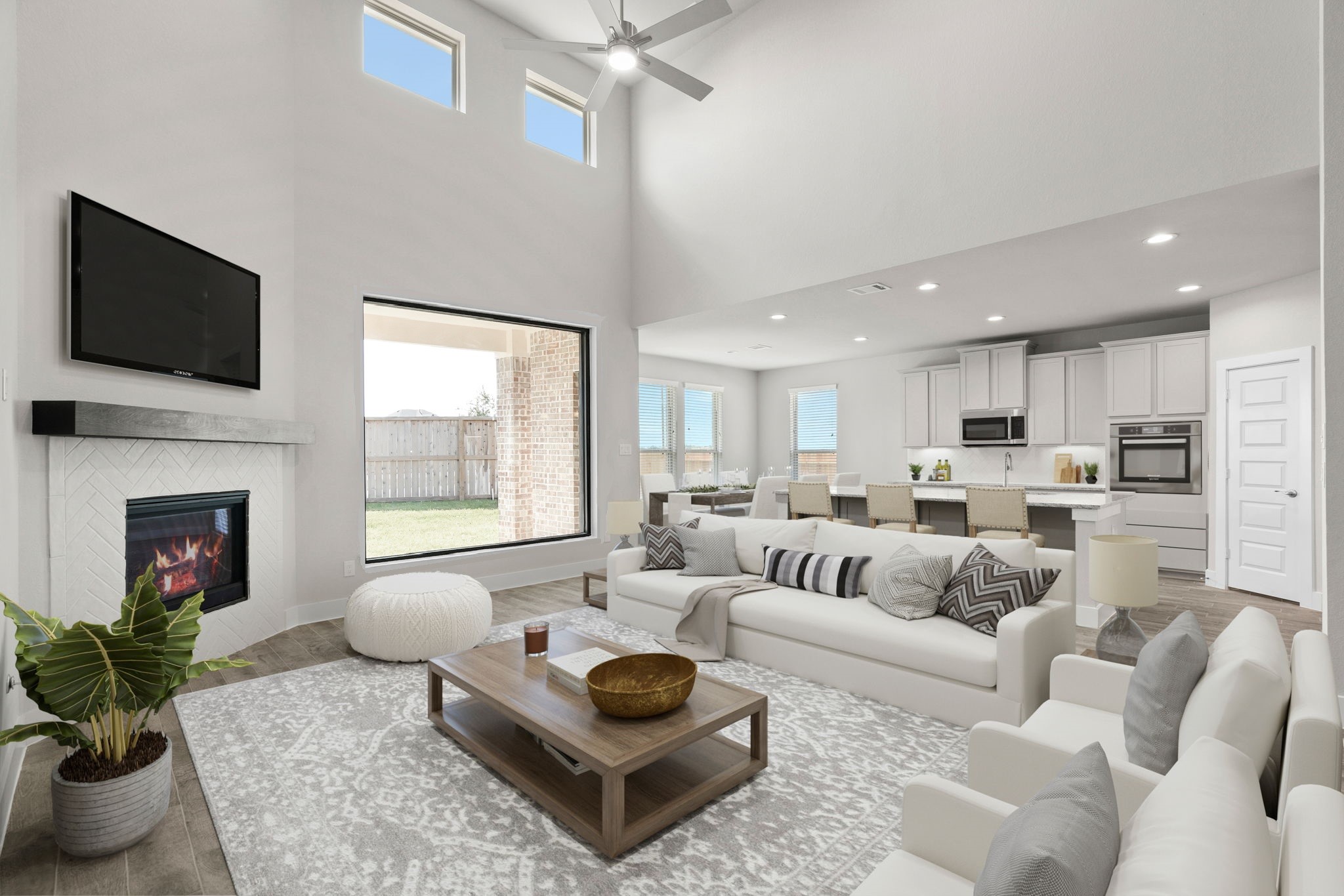 3103 Native Spg Drive Spring, TX 77373 - Photo 17 of 36 VS. Welcome family and guests to your charming living room! With its high ceilings, recessed lighting, ceiling fan, custom paint, beautiful flooring, and large windows that let in abundant natural light, this room is perfect for gatherings. Sample photo of completed home with similar floor plan. Actual colors and selections may vary.