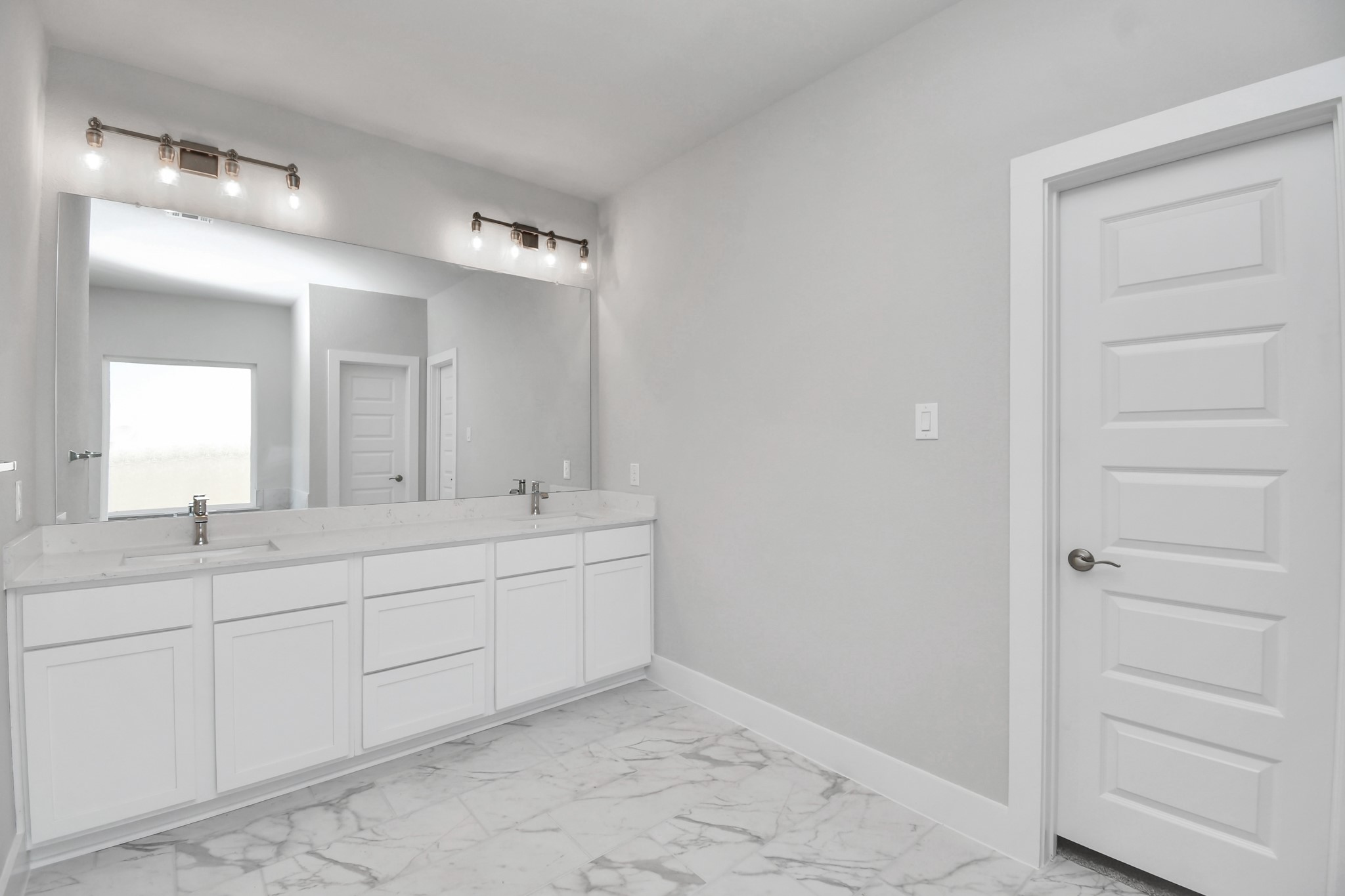 3103 Native Spg Drive Spring, TX 77373 - Photo 20 of 36 Escape to a spa-like oasis in this primary bathroom. Enjoy a walk-in shower with tile surround, a separate garden tub with custom detailing, and an elegant vanity featuring light countertops, modern hardware, and beautiful vanity lights. Experience luxury and relaxation in every detail. Sample photo of completed home with similar floor plan. Actual colors and selections may vary.