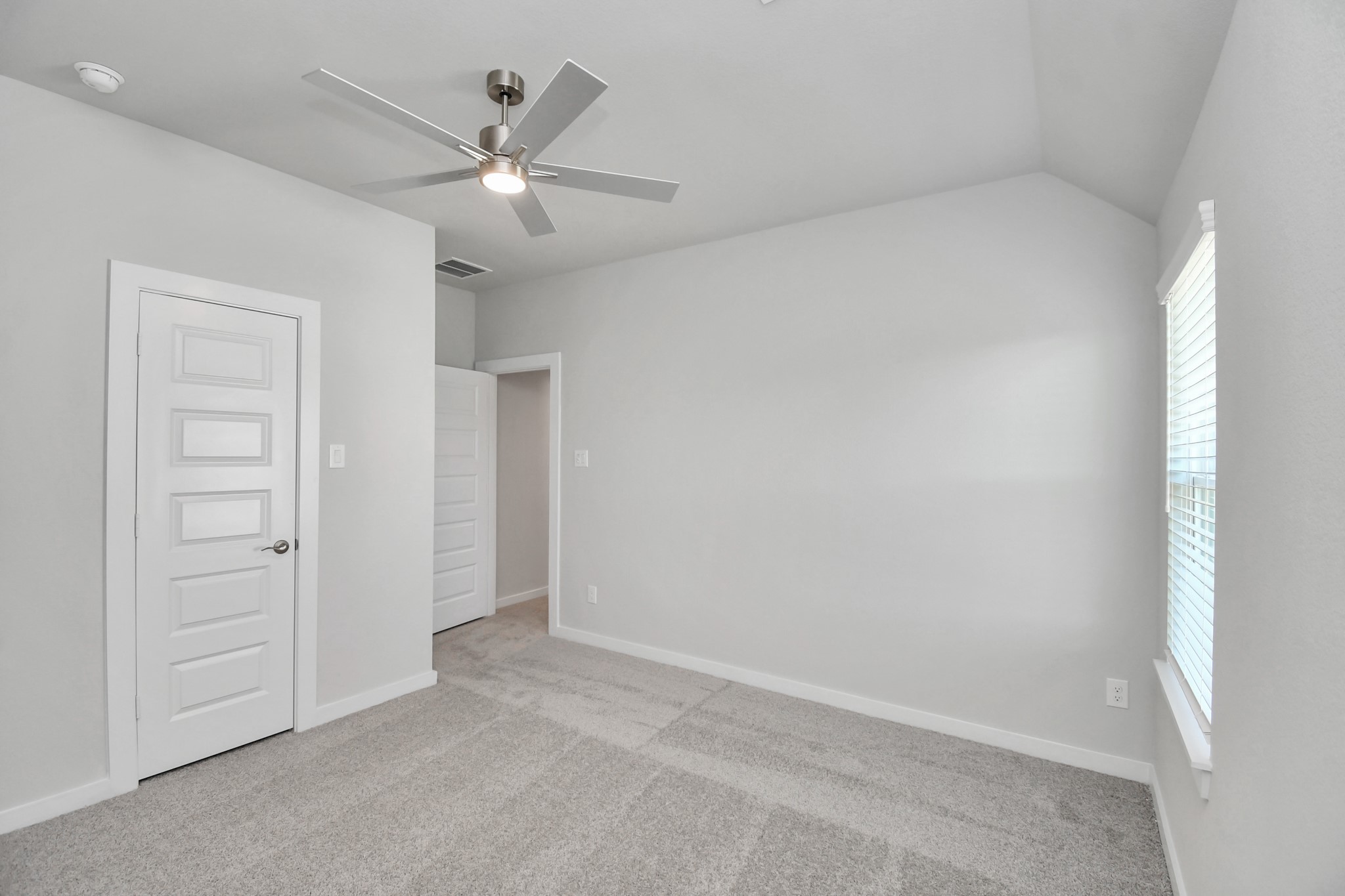 3103 Native Spg Drive Spring, TX 77373 - Photo 26 of 36 Generously sized secondary bedrooms featuring spacious closets, soft and inviting carpeting underfoot, large windows allowing plenty of natural light, and the added touch of privacy blinds for your personal retreat. Sample photo of completed home with similar floor plan. Actual colors and selections may vary.