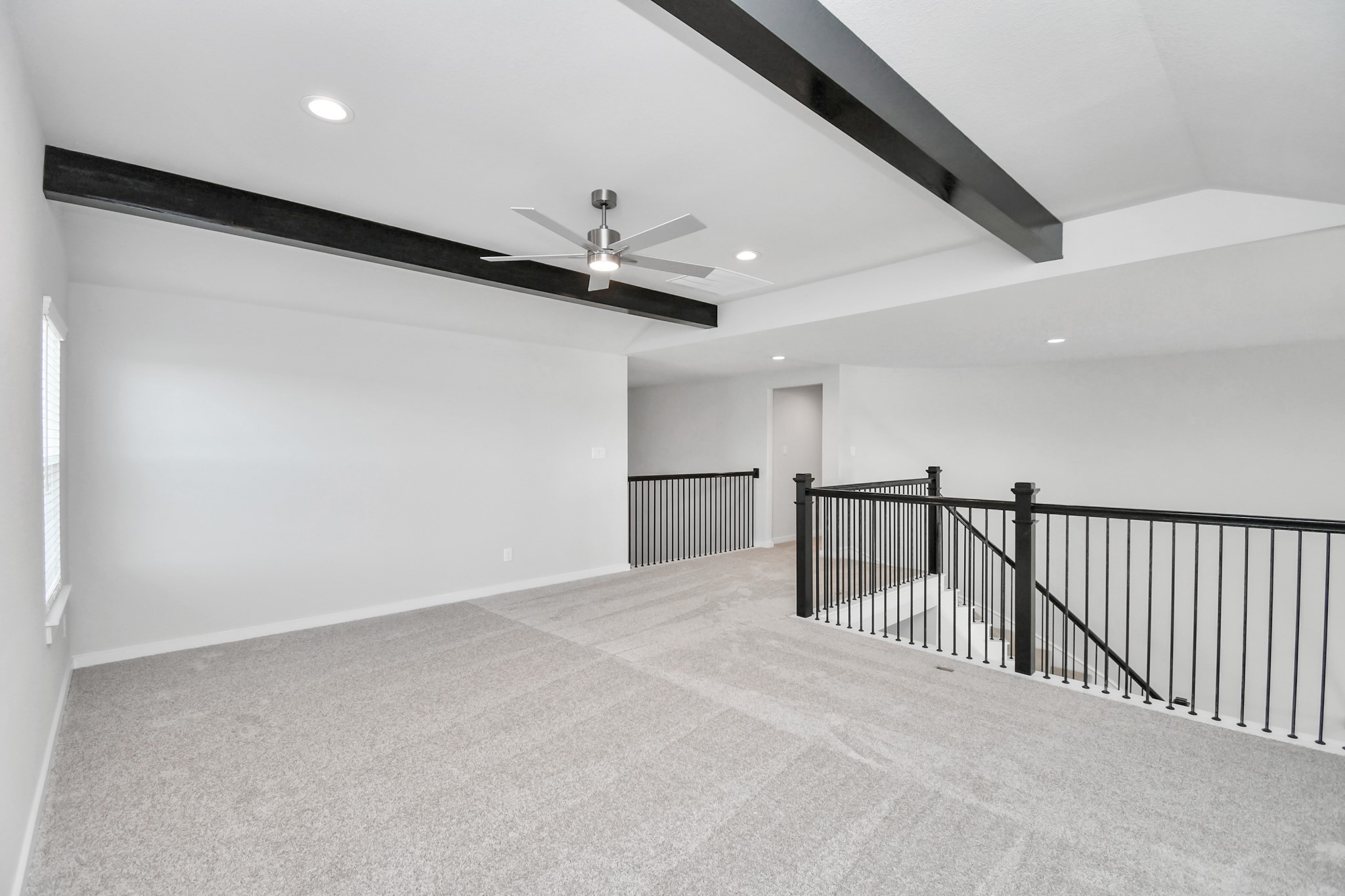 3103 Native Spg Drive Spring, TX 77373 - Photo 29 of 36 Come upstairs and enjoy a day of leisure in this fabulous game room! This is the perfect hangout spot or adult game room! Features plush carpet, high ceilings, custom paint and windows for plenty of natural light. Sample photo of completed home with similar floor plan. Actual colors and selections may vary.