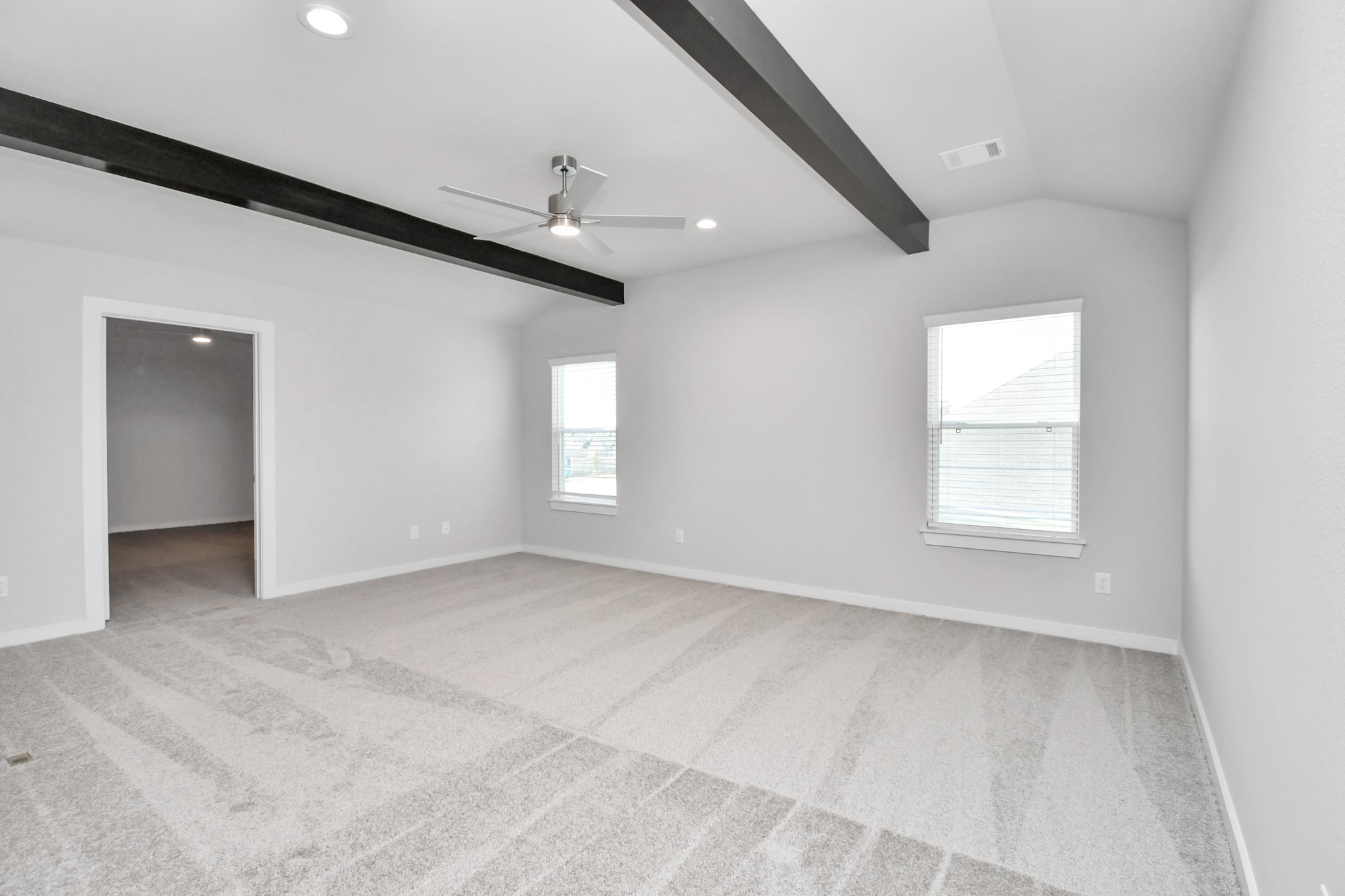 3103 Native Spg Drive Spring, TX 77373 - Photo 30 of 36 Ascend to relaxation in this fantastic game room! Ideal for both casual gatherings and adult gaming, it boasts plush carpet, lofty ceilings, custom paint, and ample windows for abundant natural light. Sample photo of completed home with similar floor plan. Actual colors and selections may vary.