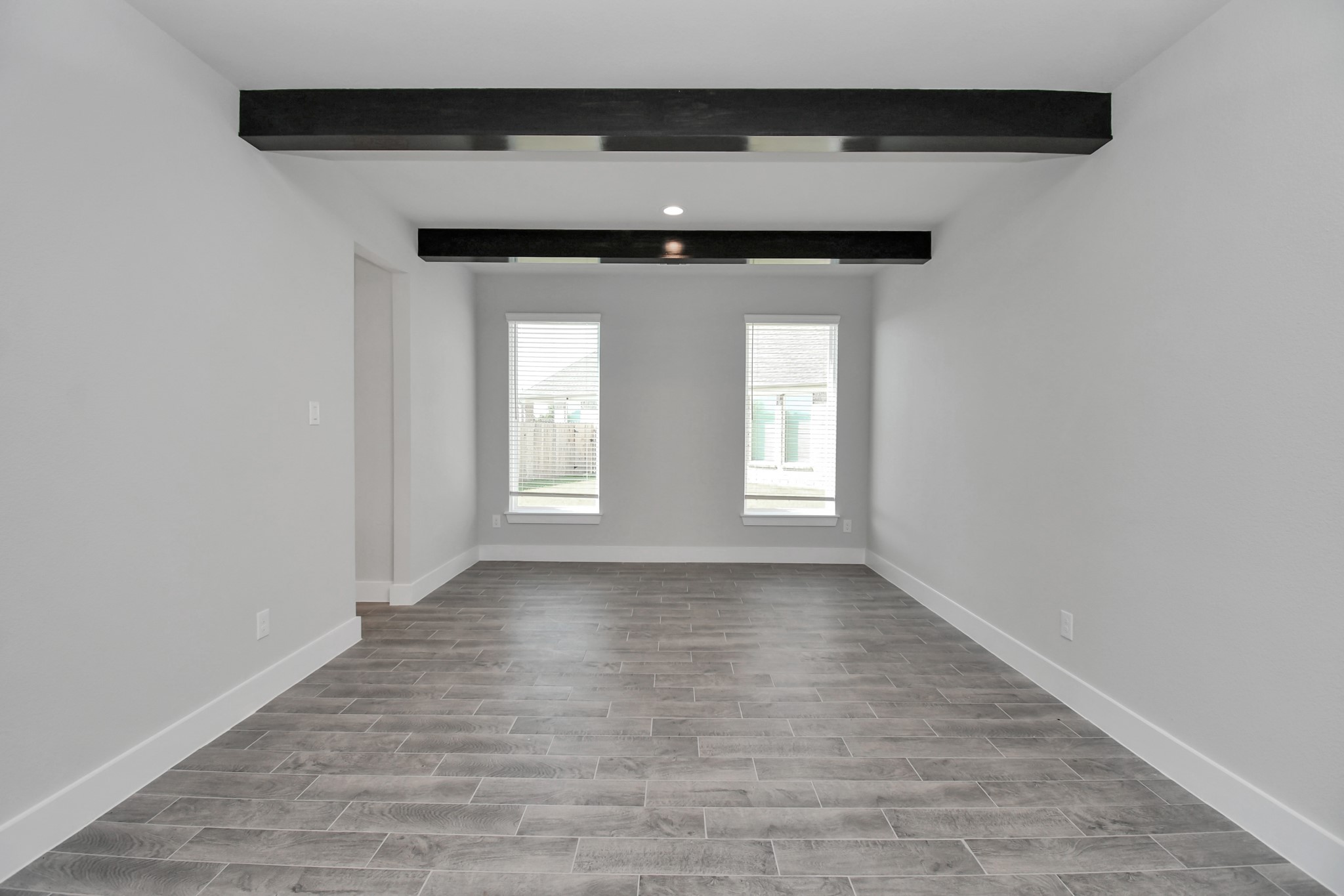 3103 Native Spg Drive Spring, TX 77373 - Photo 6 of 36 Make memories gathered around the table with your family and friends! This spacious dining room features elegant flooring, custom paint, and adjacent to family room and kitchen for open concept feel. Sample photo of completed home with similar floor plan. Actual colors and selections may vary.