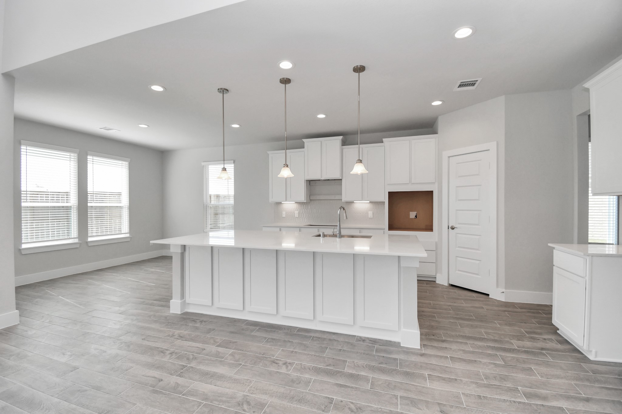 3103 Native Spg Drive Spring, TX 77373 - Photo 9 of 36 The kitchen is a culinary haven, featuring granite countertops, a tile backsplash, stainless steel appliances, 42” upper cabinets, and undercabinet lighting. Sample photo of completed home with similar floor plan. Actual colors and selections may vary.