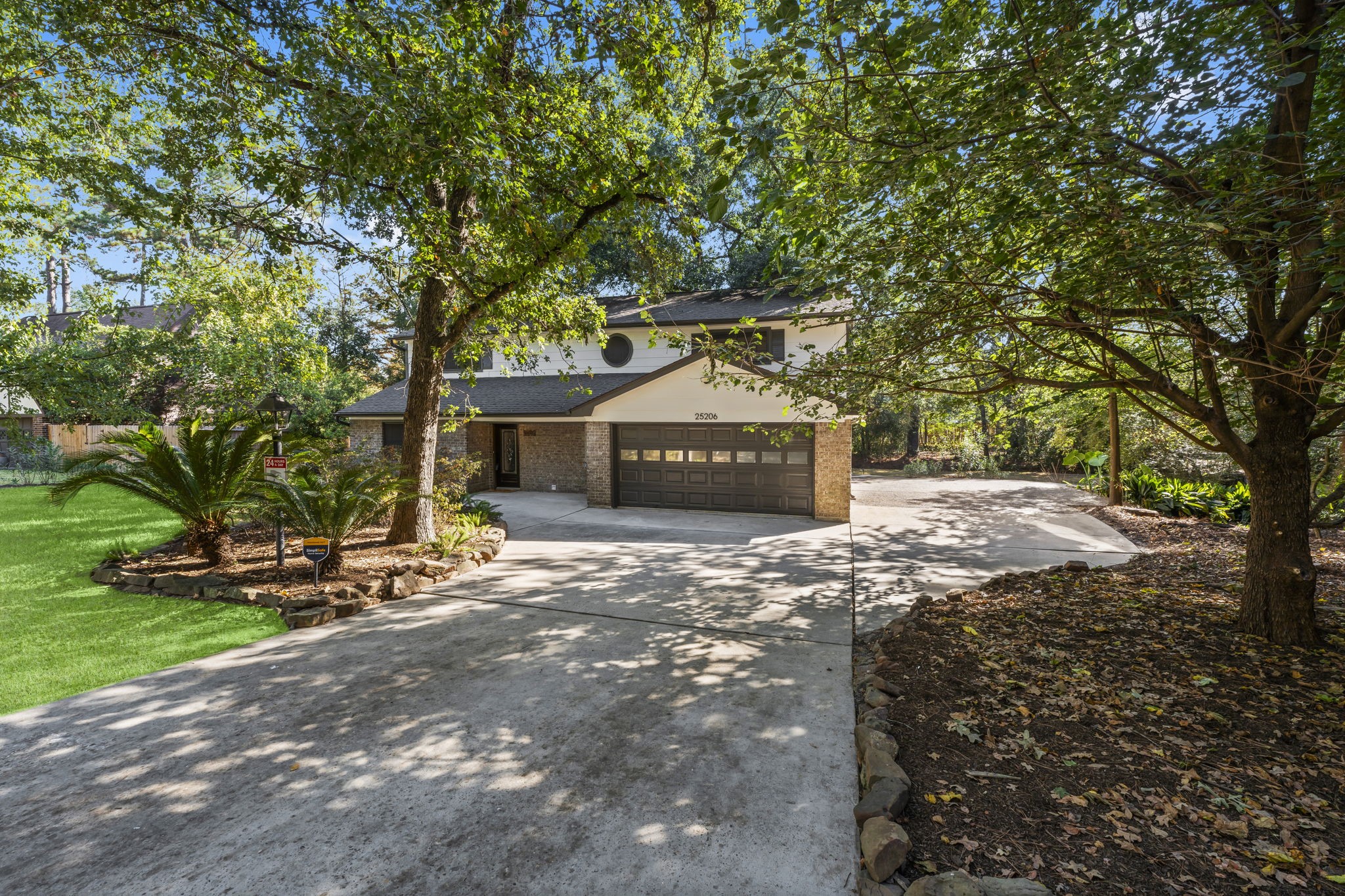 a view of a tree in front of a house