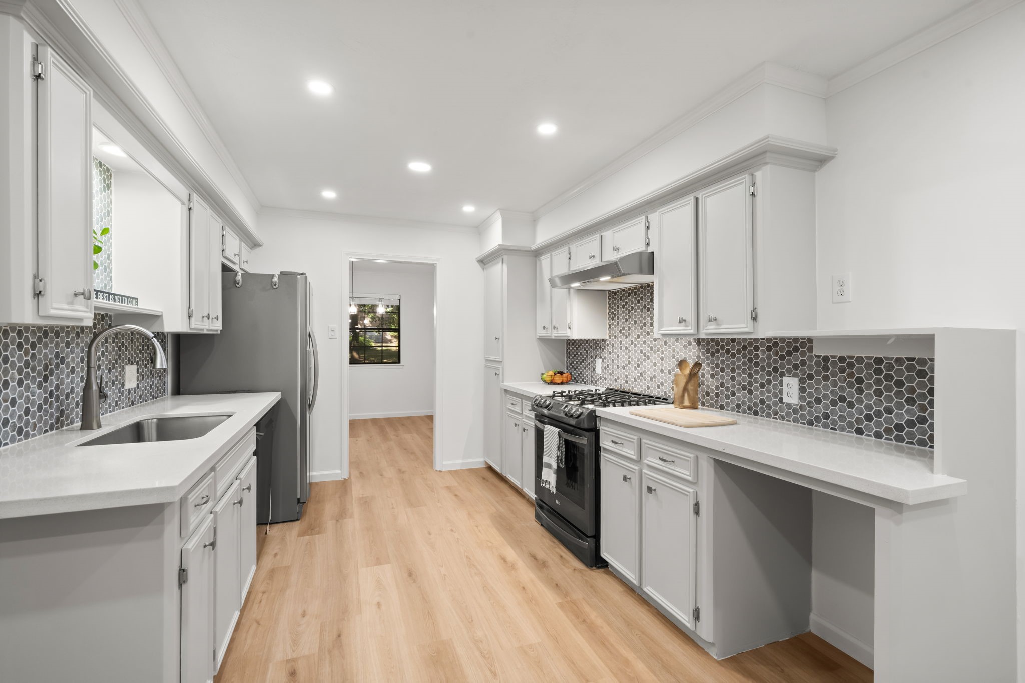 25206 Spring Ridge Drive Spring, TX 77386 - Photo 10 of 37 a kitchen with stainless steel appliances granite countertop a sink stove and refrigerator