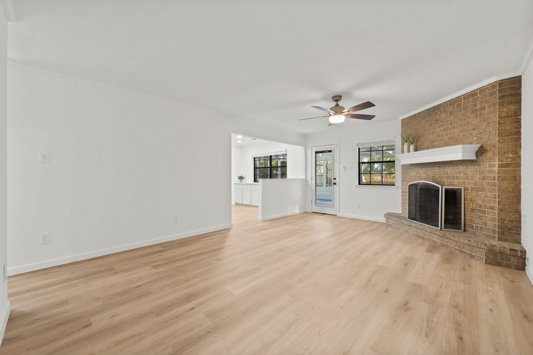 25206 Spring Ridge Drive Spring, TX 77386 - Photo 11 of 37 a view of empty room with fireplace and wooden floor