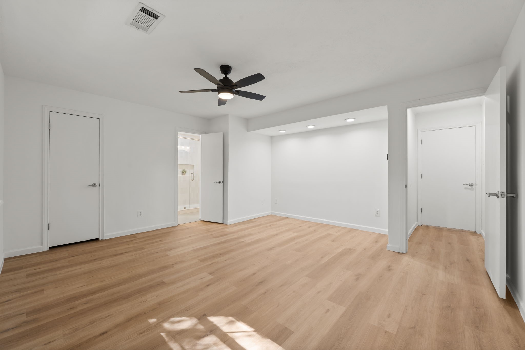 25206 Spring Ridge Drive Spring, TX 77386 - Photo 14 of 37 a view of empty room with wooden floor and ceiling fan
