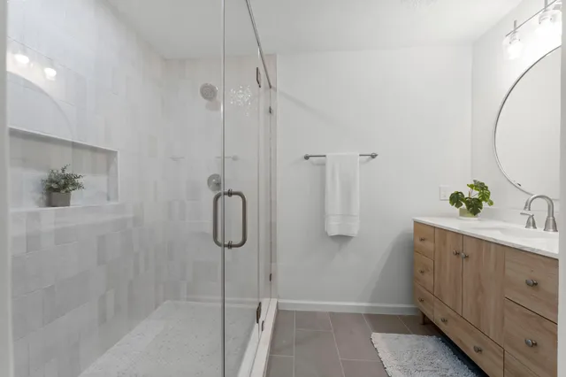 a spacious bathroom with a double vanity sink mirror and