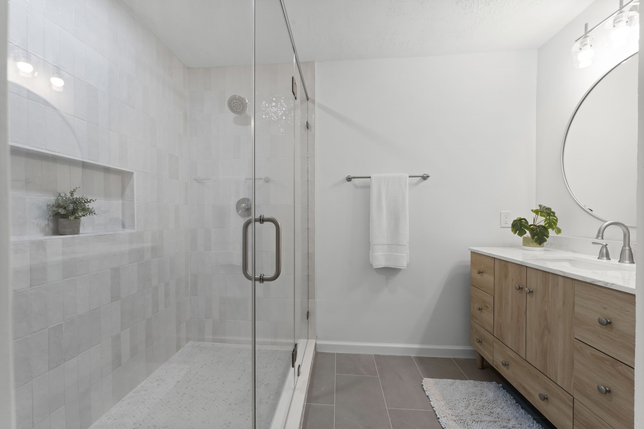 25206 Spring Ridge Drive Spring, TX 77386 - Photo 17 of 37 a bathroom with a shower sink and mirror