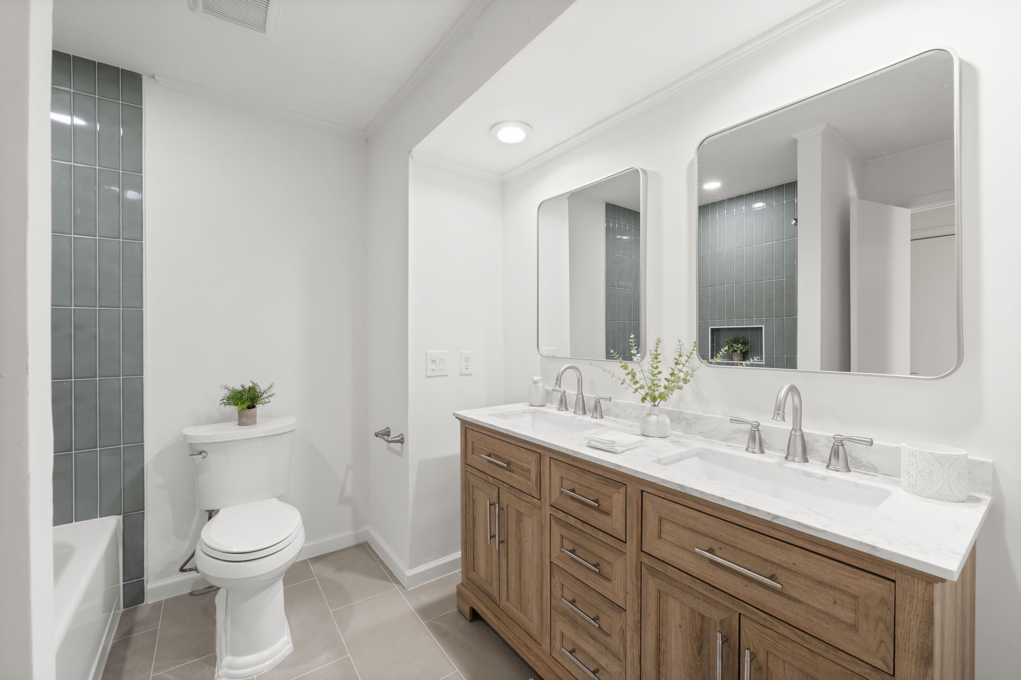 25206 Spring Ridge Drive Spring, TX 77386 - Photo 24 of 37 a bathroom with a granite countertop toilet a sink and a mirror
