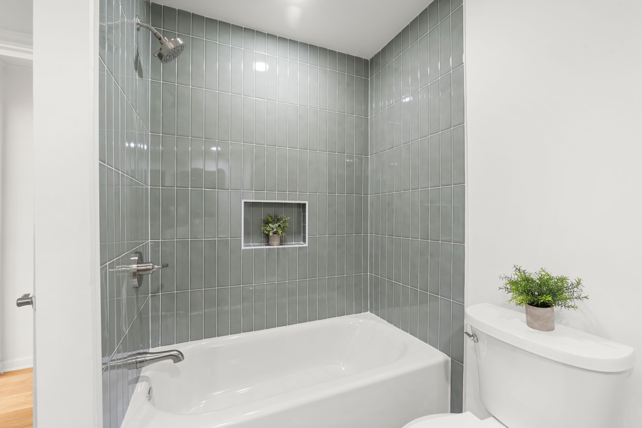 25206 Spring Ridge Drive Spring, TX 77386 - Photo 25 of 37 a bathroom with a shower a toilet and a bathtub