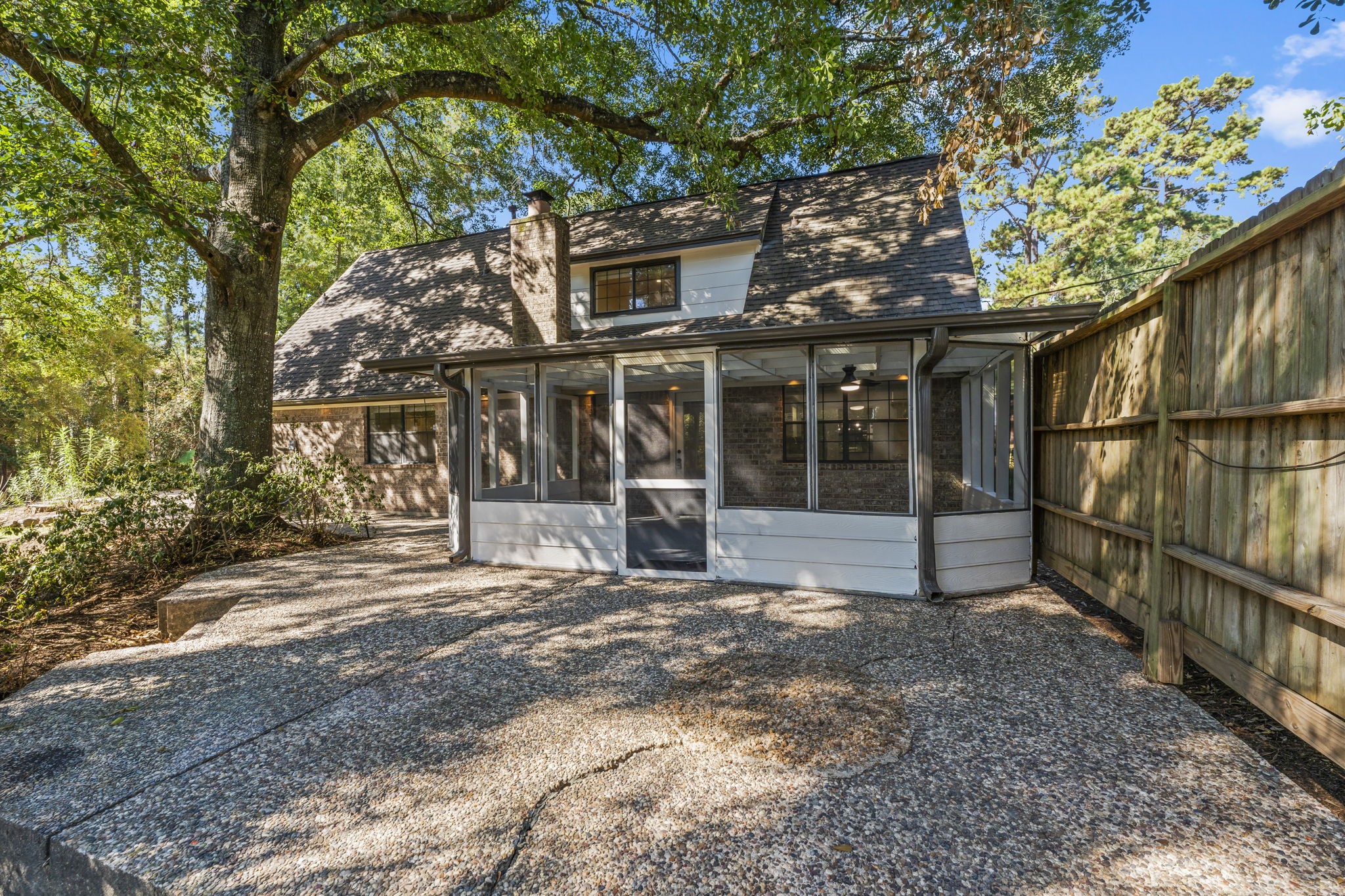 25206 Spring Ridge Drive Spring, TX 77386 - Photo 32 of 37 a view of a house with a large tree and a yard