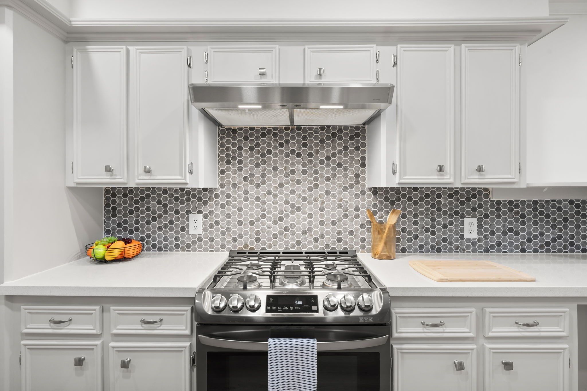 25206 Spring Ridge Drive Spring, TX 77386 - Photo 8 of 37 a kitchen with a stove and cabinets
