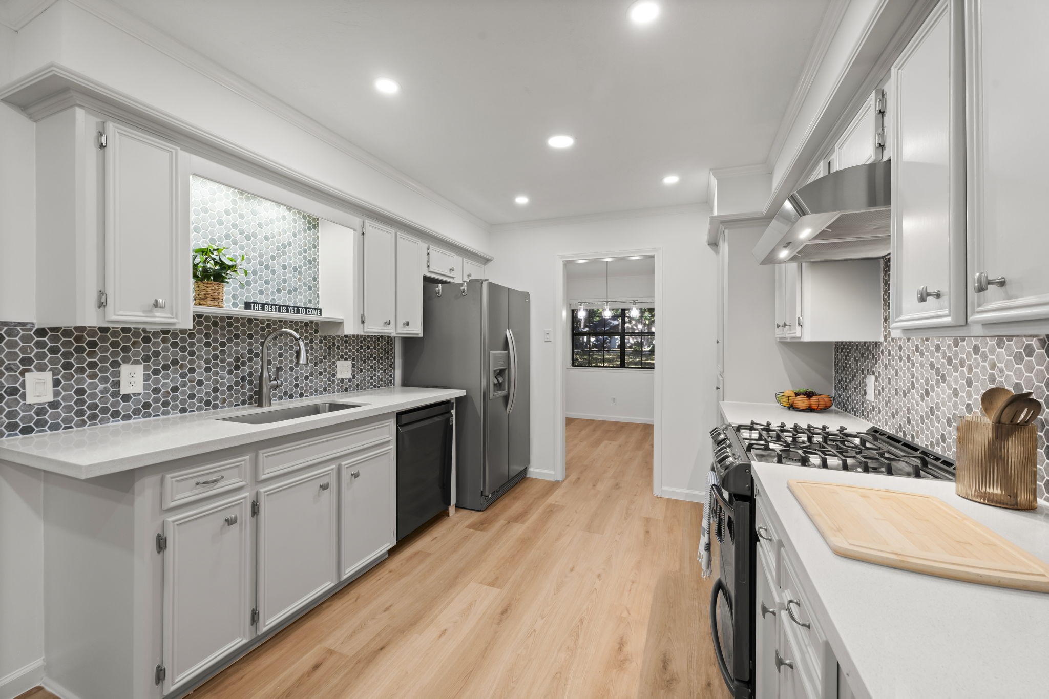25206 Spring Ridge Drive Spring, TX 77386 - Photo 9 of 37 a kitchen with a sink stove and refrigerator