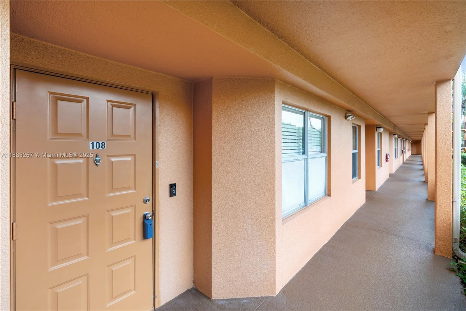 701 Southwest 142nd Avenue, Unit 108S Pembroke Pines, FL 33027 - Photo 20 of 25 a view of a hallway with windows