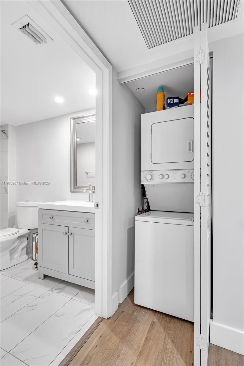 701 Southwest 142nd Avenue, Unit 108S Pembroke Pines, FL 33027 - Photo 9 of 25 a utility room with dryer and washer