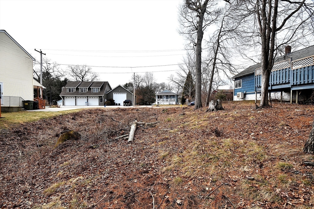 16 Black Point Road Webster, MA 01570 - Photo 6 of 14 a view of a yard covered with snow in the background