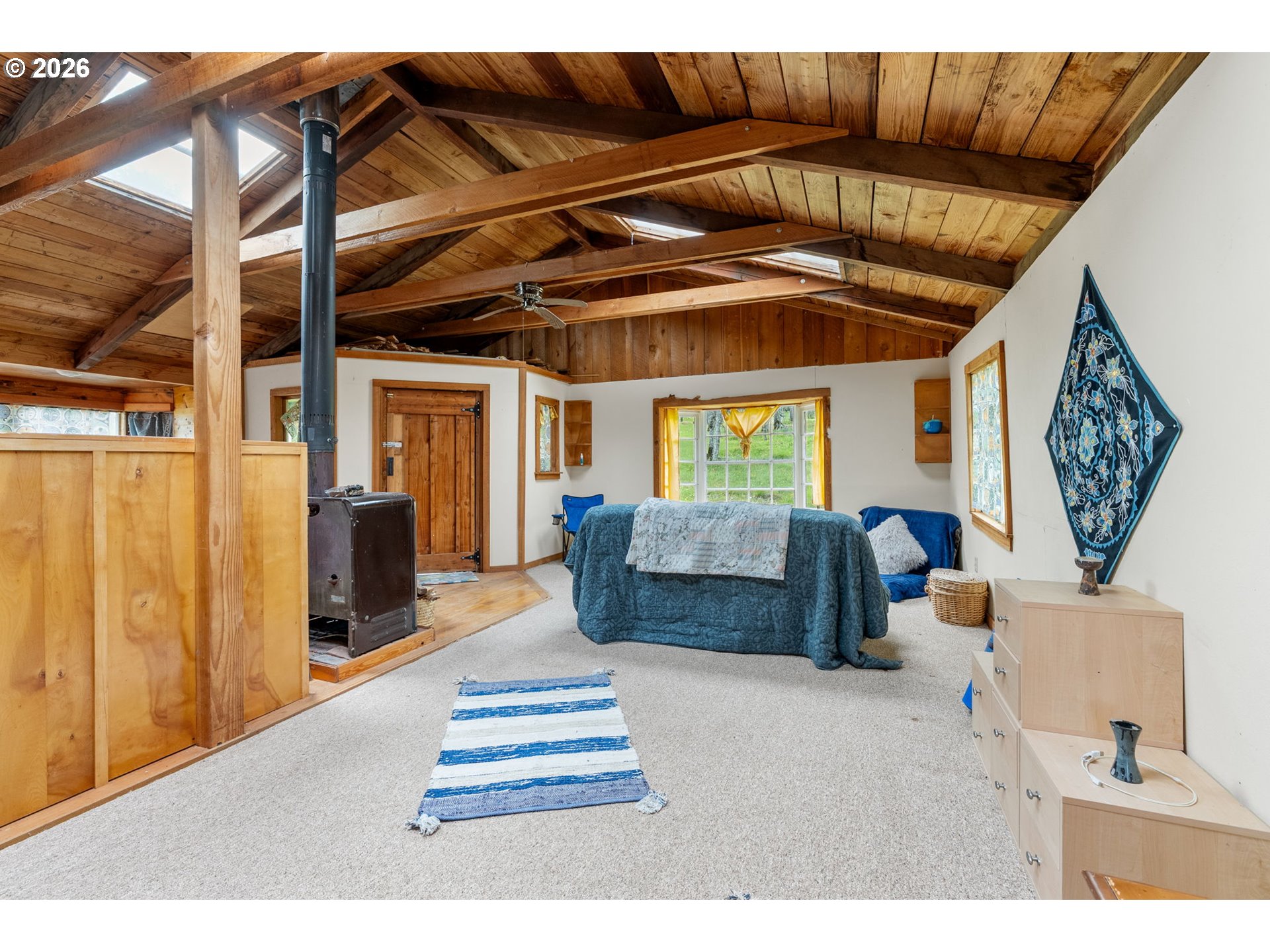 Evergreen Terrace Mosier, OR 97040 - Photo 18 of 22 a bedroom with furniture and a window