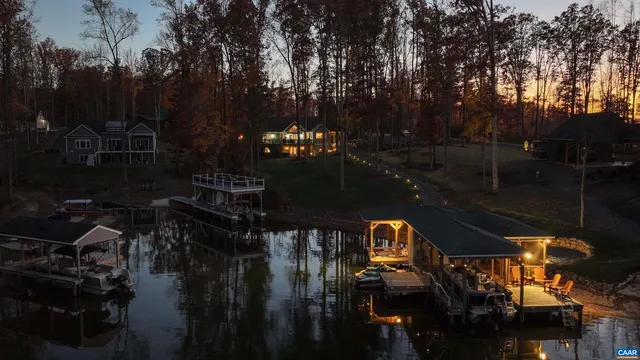 a spacious bedroom with a bed a dresser and a window
