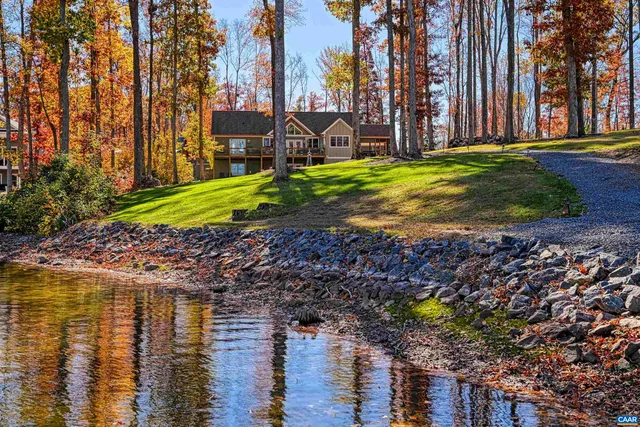 a bathroom with a sink toilet a mirror and shower