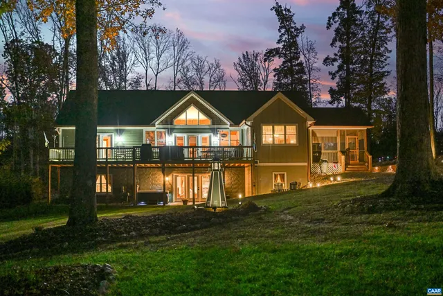 a front view of a house with a yard table and chairs