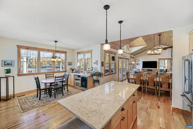 a living room with furniture and kitchen view