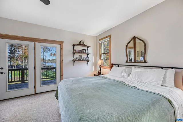 a bedroom with a bed furniture and a window