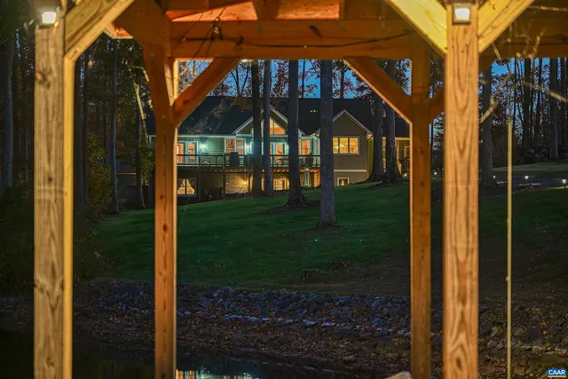 a view of house with outdoor space and swimming pool