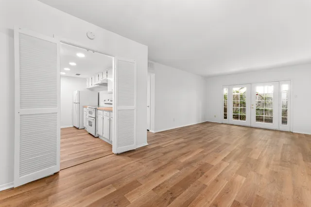 a view of a livingroom with furniture and a wooden floor
