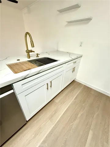 a kitchen with stainless steel appliances granite countertop a stove and a sink