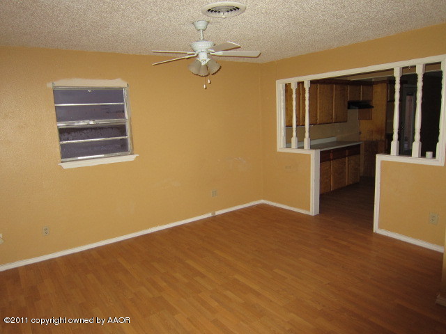 4501 South Bonham Street Amarillo, TX 79110 - Photo 3 of 13 a view of an empty room with a window