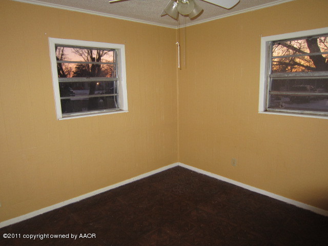 4501 South Bonham Street Amarillo, TX 79110 - Photo 6 of 13 a view of a small space with wooden floor and a window