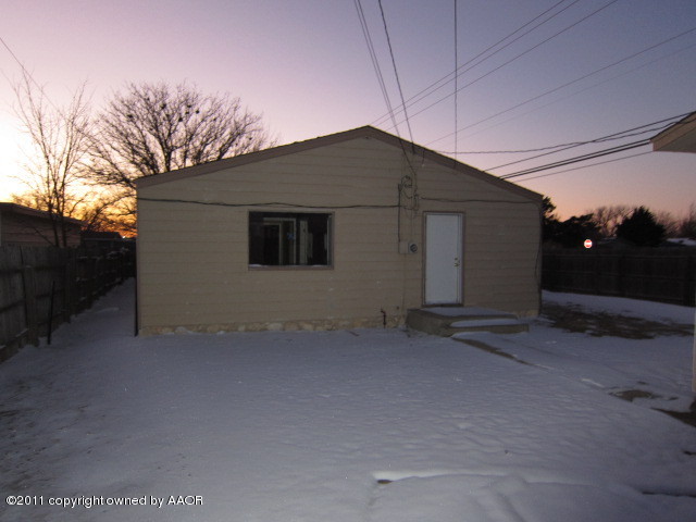 4501 South Bonham Street Amarillo, TX 79110 - Photo 8 of 13 a backyard of a house with lots of green space and a yard