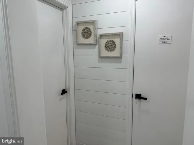 a bathroom with a shower and a door