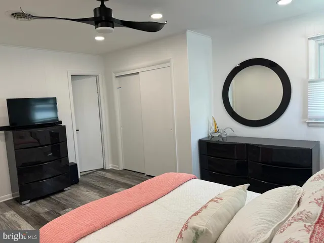 a bedroom with a bed and a dresser