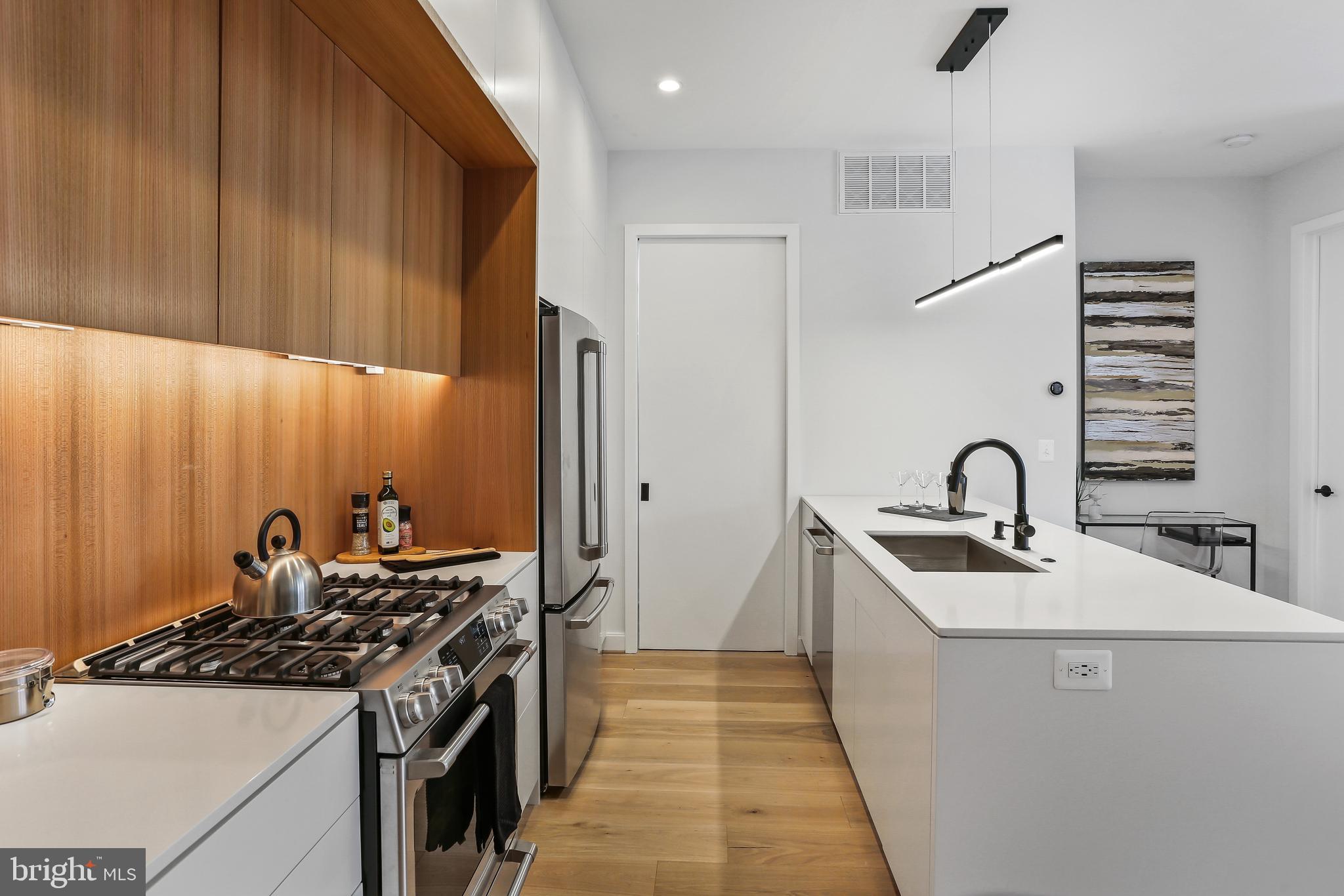 1434 Chapin Street Northwest, Unit 6 Washington, DC 20009 - Photo 15 of 37 Cafe Series Gas Range, Quartz Countertops