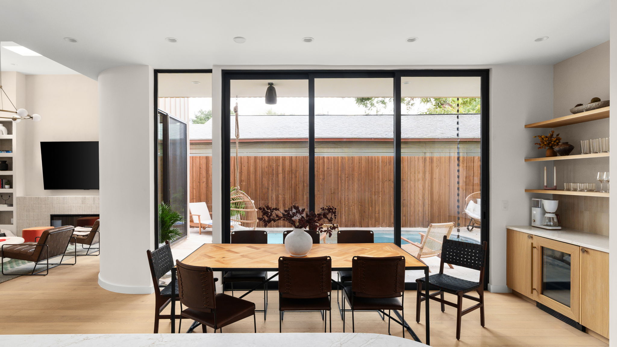Undisclosed Address Austin, TX 78702 - Photo 14 of 38 Dining area with floor to ceiling windows, light wood-style floors, and a fireplace