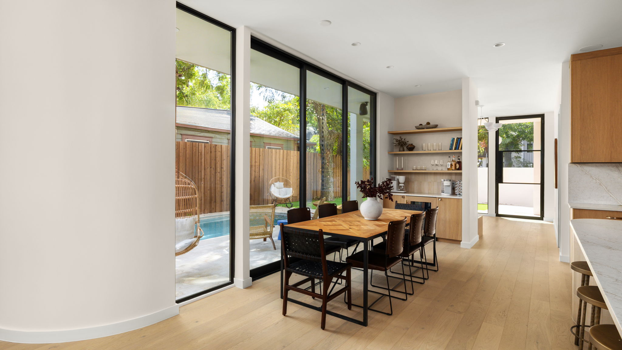 Undisclosed Address Austin, TX 78702 - Photo 15 of 38 Dining space with light wood-style flooring and expansive windows
